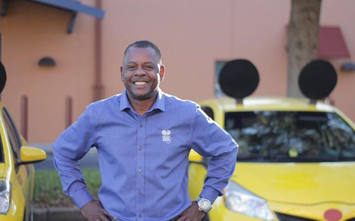 man in front of mouse car