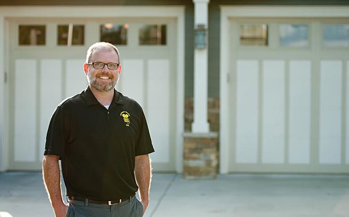 Truly Nolan Franchisee in front of a house