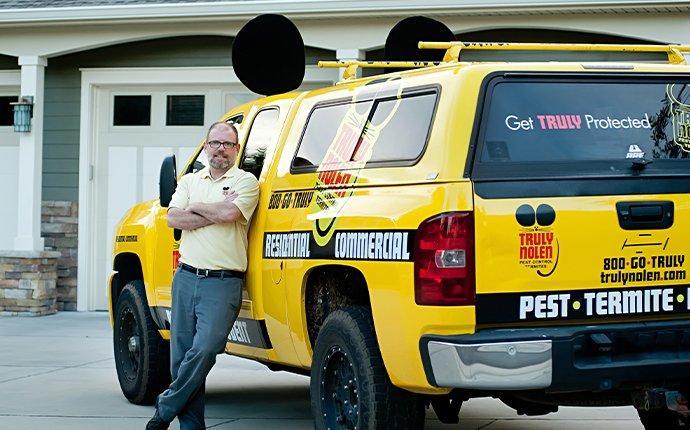 Truly Nolan franchisee in front of truck